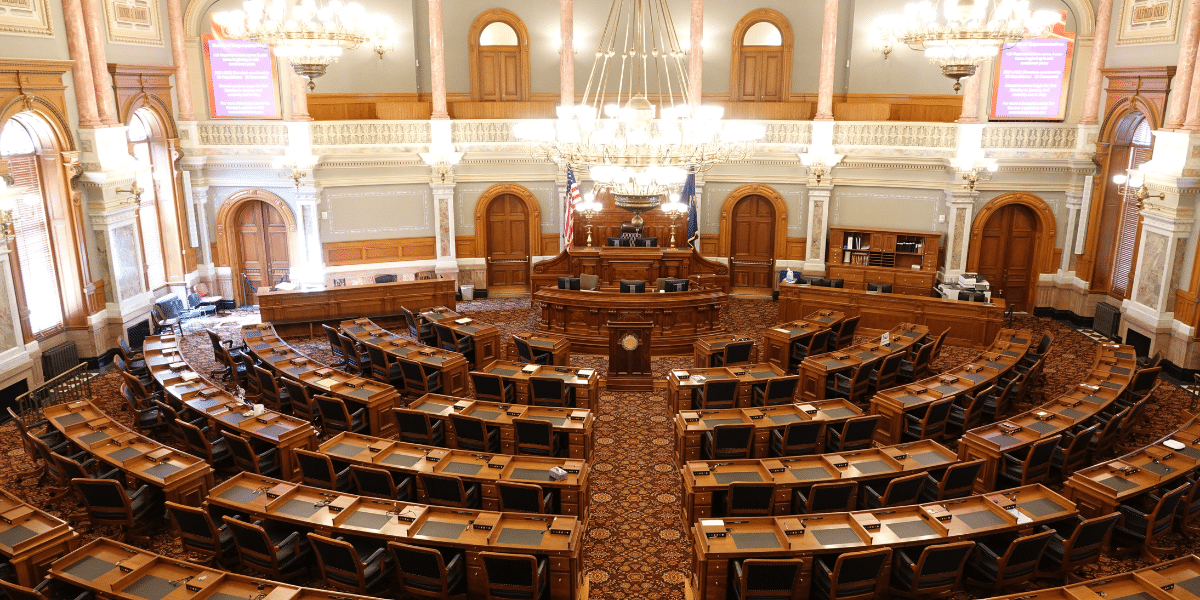 A photo of the empty Floor of the House of Representatives, within the House Chamber, where Representatives and Delegates assemble to introduce, debate, and vote on pieces of legislation. Representing where the Inflation Reduction Act to move through to pass.